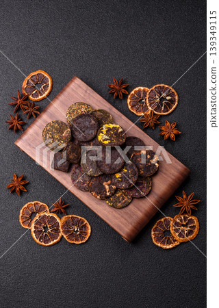 Organic Chinese green pu-erh tea with various herbs in round bricks. Chinese pu-erh tea Organic Chinese green pu-erh tea with various herbs in round bricks. Chinese pu-erh tea 139349115