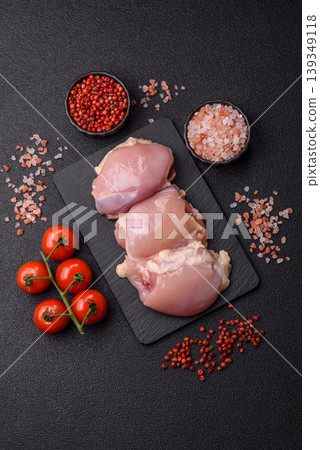 Raw chicken thigh fillet, boneless and skinless, for roasting. Raw thigh fillet 139349118