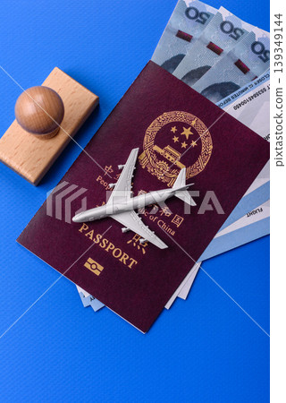 China, Chinese passport with money and flight tickets. Chinese passport 139349144