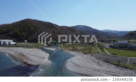 Aerial view of the natural scenery of the Chihaze River estuary and the Sea of Japan in Shimamaki Village, Hokkaido. Aerial view of the natural scenery of the Chihaze River estuary and the Sea of Japan in Shimamaki Village, Hokkaido. 139349156