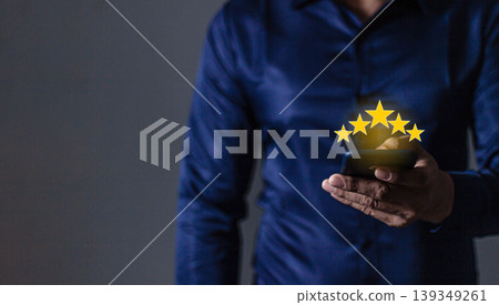 Customer Review, Young Man hand holding Smart Phone touching five star to review and give 5 stars with very good results in service, Good review 5 star rating choice feedback Customer Review, Young Man hand holding Smart Phone touching five star to review and give 5 stars with very good results in service, Good review 5 star rating choice feedback 139349261