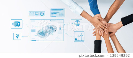 Collaborative Hands in a Teamwork Setting with Project Data Visualization Graphics on a Table Displaying Innovations in Electric Vehicle Technology Trope Collaborative Hands in a Teamwork Setting with Project Data Visualization Graphics on a Table Displaying Innovations in Electric Vehicle Technology Trope 139349292