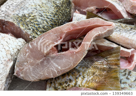 Fresh cut fish representing seafood market display and raw ingredient preparation. Fresh cut fish representing seafood market display and raw ingredient preparation. 139349663