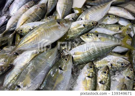 Small fresh fish arranged in a pile representing seafood harvest and market stock. Small fresh fish arranged in a pile representing seafood harvest and market stock. 139349671