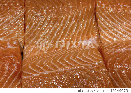 Salmon fillet close up representing premium fresh seafood and healthy cooking ingredient. Salmon fillet close up representing premium fresh seafood and healthy cooking ingredient. 139349673