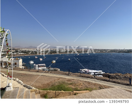 Naama Bay in Sharm El Sheikh with boats on the blue water Naama Bay in Sharm El Sheikh with boats on the blue water 139349793
