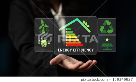 Business Person Presenting Energy Efficiency Concept with Graphical Icons Representing Sustainability and Renewable Energy Solutions Quark 139349927