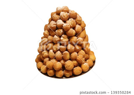 Croquembouche tower of cream puffs with caramel Croquembouche tower of cream puffs with caramel 139350284