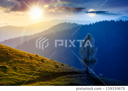 day meet night in mountainous rural landscape in spring. epic view of valley fields at twilight. sun and moon over alpine meadow. carpathian mountains countryside with forest near pasture. harmony day meet night in mountainous rural landscape in spring. epic view of valley fields at twilight. sun and moon over alpine meadow. carpathian mountains countryside with forest near pasture. harmony 139350678