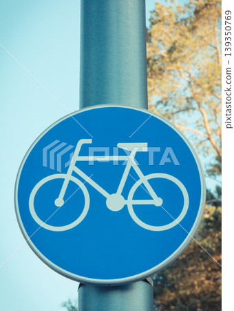 Blue sign informing about bike or bicycle lane. Safety during biking Blue sign informing about bike or bicycle lane. Safety during biking 139350769
