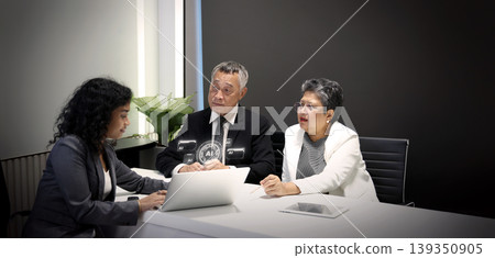 Using Ai. Business team discussing AI analytics and digital strategy during a corporate meeting. Professional presentation with Ai data dashboards charts and technology insights in a modern office. Using Ai. Business team discussing AI analytics and digital strategy during a corporate meeting. Professional presentation with Ai data dashboards charts and technology insights in a modern office. 139350905