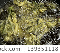 Preparing tempura made with buds of the Japanese angelica tree. 139351118