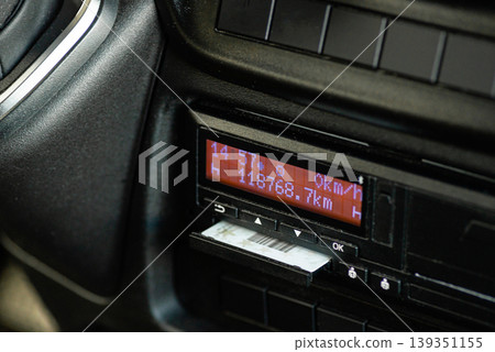 Digital tachograph with inserted professional driver chip card Digital tachograph with inserted professional driver chip card 139351155