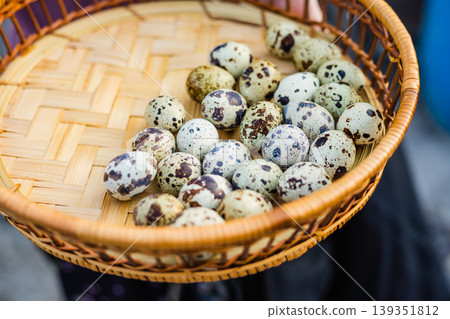 Basket full of speckled quail eggs, a natural and healthy food source Basket full of speckled quail eggs, a natural and healthy food source 139351812