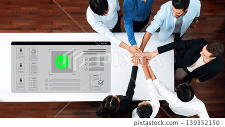 Team Collaboration and Success with Hands Together Over Digital Interface Displaying Check Mark for Achievements in Modern Workspace Cyphers. Team Collaboration and Success with Hands Together Over Digital Interface Displaying Check Mark for Achievements in Modern Workspace Cyphers. 139352150
