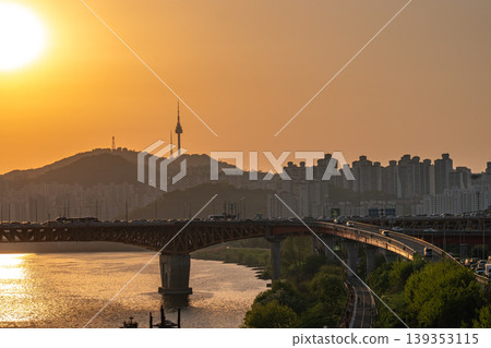 Seoul, South Korea - Jun. 25, 2023 : A refreshing glass of cafe latte at Jeongdong Observatory overlooking the historic palace and city skyline Seoul, South Korea - Jun. 25, 2023 : A refreshing glass of cafe latte at Jeongdong Observatory overlooking the historic palace and city skyline 139353115