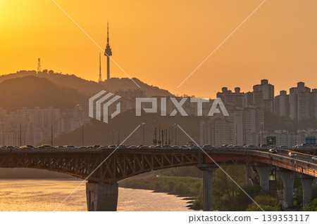 Seoul, South Korea - Jun. 25, 2023 : A refreshing glass of cafe latte at Jeongdong Observatory overlooking the historic palace and city skyline Seoul, South Korea - Jun. 25, 2023 : A refreshing glass of cafe latte at Jeongdong Observatory overlooking the historic palace and city skyline 139353117