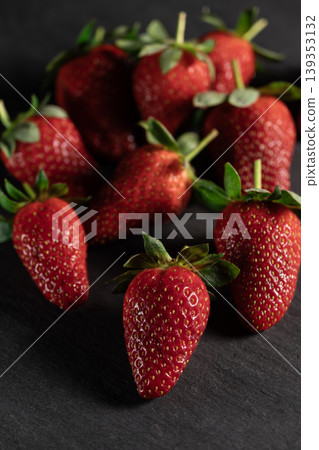 Organic Strawberries on Dark Granite Background. Organic Strawberries on Dark Granite Background. 139353132