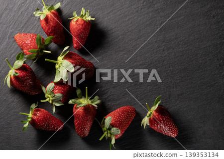 Organic Strawberries on Dark Granite Background. Organic Strawberries on Dark Granite Background. 139353134