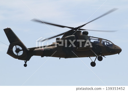 The Japan Ground Self-Defense Force's OH-1 helicopter conducts a demonstration flight. 139353452