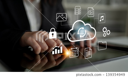 Cloud Computing Technology and Data Management Concept with Icons and Graphics on Table Demonstrating Digital Connectivity and Security in Business Environment Gantry 139354949