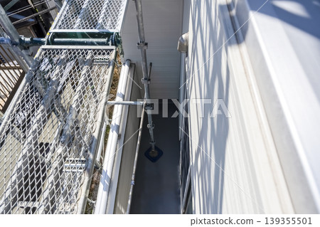 View of the balcony and scaffolding after the exterior wall renovation. View of the balcony and scaffolding after the exterior wall renovation. 139355501