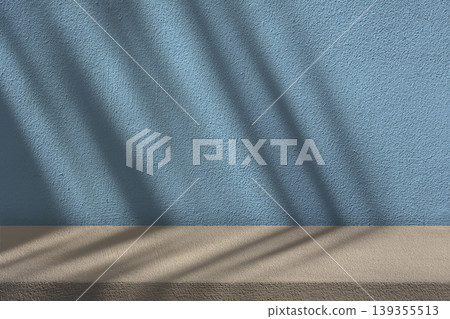 Minimalist Display Background Featuring Textured Blue Concrete Wall and a Beige Surface, Often used for Product Photography and Mockups. Minimalist Display Background Featuring Textured Blue Concrete Wall and a Beige Surface, Often used for Product Photography and Mockups. 139355513
