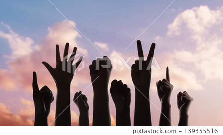 Group of raised hands protest gesture against sky, freedom expression, social movement Group of raised hands protest gesture against sky, freedom expression, social movement 139355516