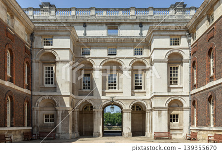 Timeless symmetry in Portland stone. The orderly Neoclassical design of the Old Royal Naval College reflects a sense of permanence, with its grand central arch acting as a gateway between historic Timeless symmetry in Portland stone. The orderly Neoclassical design of the Old Royal Naval College reflects a sense of permanence, with its grand central arch acting as a gateway between historic 139355670