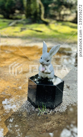 A charming stone statue of the "White Rabbit of Inaba" stands within the grounds of Izumo Taisha Shrine. A charming stone statue of the "White Rabbit of Inaba" stands within the grounds of Izumo Taisha Shrine. 139356272