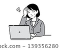 A young woman in a suit, holding her head in her hands in front of a computer; an office worker. 139356280