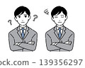A young man in a suit with his arms crossed; two different facial expressions. 139356297