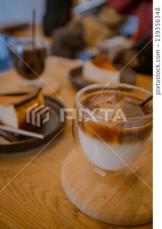 A popular dessert at the cafe: a set of rich Basque cheesecake and iced coffee. A popular dessert at the cafe: a set of rich Basque cheesecake and iced coffee. 139356348