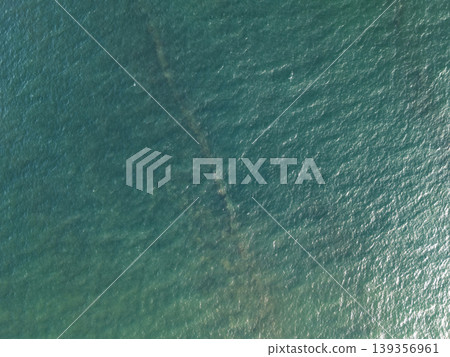 Wreck remains visible under calm water in coastal area Wreck remains visible under calm water in coastal area 139356961