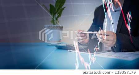 businessman analyzing financial data. Falling stock market chart overlay showing economic crisis, investment loss, and market crash concept businessman analyzing financial data. Falling stock market chart overlay showing economic crisis, investment loss, and market crash concept 139357179
