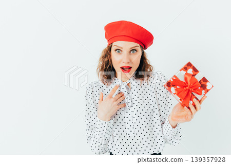 Young woman wearing red beret and polka-dot shirt 139357928