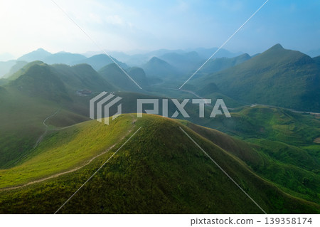 Lush green rolling hill of Ba Quang Grass Hill in countryside during morning at Vietnam 139358174