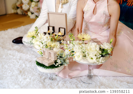 Elegant Thai Chinese engagement ceremony with wedding rings and gold Elegant Thai Chinese engagement ceremony with wedding rings and gold 139358211