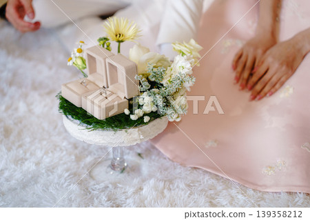 Elegant Thai Chinese engagement ceremony with wedding rings and gold Elegant Thai Chinese engagement ceremony with wedding rings and gold 139358212
