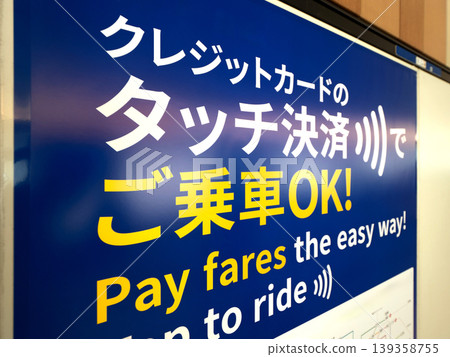 A sign reads "You can board with contactless payment." A sign reads "You can board with contactless payment." 139358755