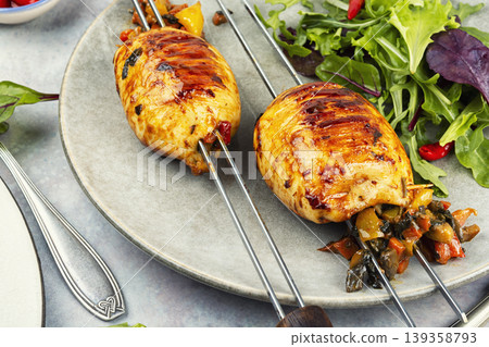 Mediterranean stuffed squid skewers. Mediterranean stuffed squid skewers. 139358793