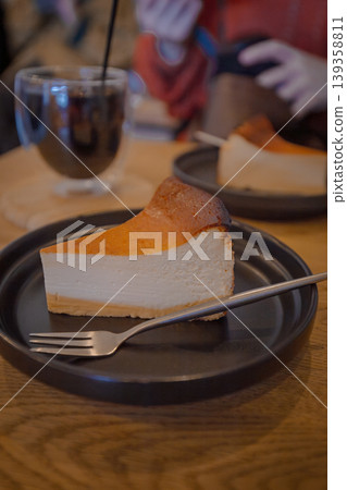 A popular dessert at the cafe: a set of rich Basque cheesecake and iced coffee. A popular dessert at the cafe: a set of rich Basque cheesecake and iced coffee. 139358811