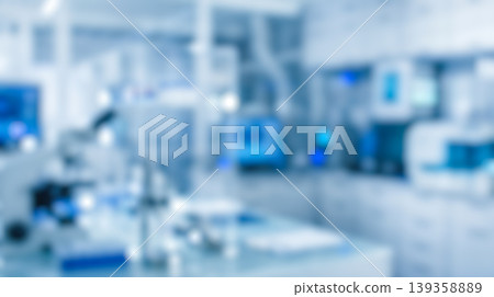 Defocused bright blue modern medical science laboratory background featuring blurry hospital clinic equipment microscopes and computer screens perfect for healthcare Defocused bright blue modern medical science laboratory background featuring blurry hospital clinic equipment microscopes and computer screens perfect for healthcare 139358889