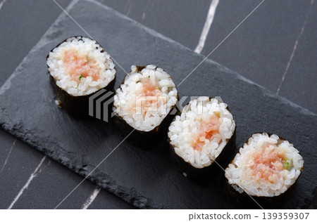 Negitoro roll - The classic thin sushi roll is negitoro roll, which is made by wrapping tuna and green onions. 139359307
