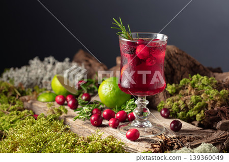 Refreshing cranberry hard seltzer with lime, rosemary, and ice. Refreshing cranberry hard seltzer with lime, rosemary, and ice. 139360049