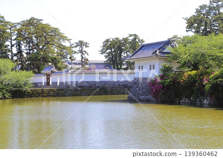 View of the corner turret and Umadashimon gate from the moat of Odawara Castle. View of the corner turret and Umadashimon gate from the moat of Odawara Castle. 139360462