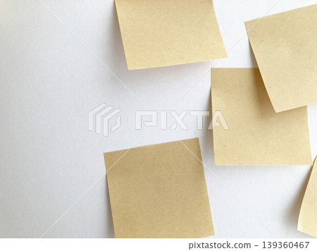 Idea generation, a large number of tasks, business, kraft paper sticky notes randomly placed on a white background, overlapping memos. 139360467
