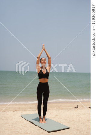 Fit woman practicing yoga on beach, outdoor Fitness and Healthy Lifestyle Concept. Fit woman practicing yoga on beach, outdoor Fitness and Healthy Lifestyle Concept. 139360917