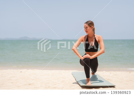 Fit woman practicing yoga on beach, outdoor Fitness and Healthy Lifestyle Concept. Fit woman practicing yoga on beach, outdoor Fitness and Healthy Lifestyle Concept. 139360923