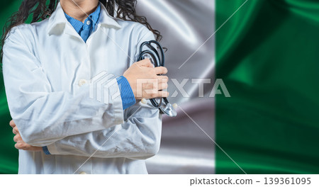 Healthcare professional with Nigeria flag background. Professional doctor holding stethoscope on Nigeria flag background 139361095